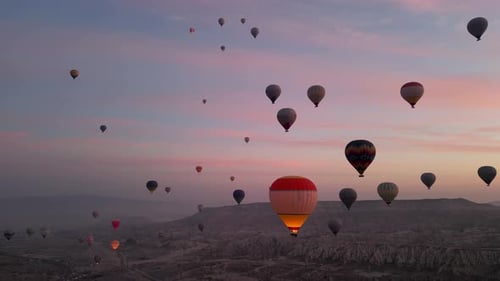Hot air balloon flight in Goreme in Turkey during sunrise.