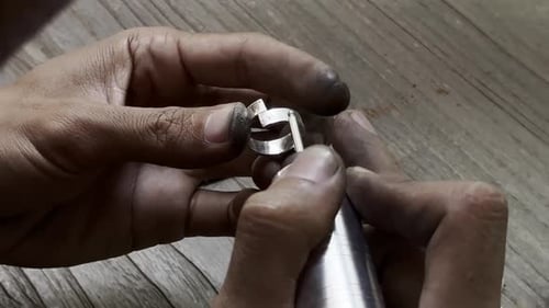 A Master Craftsman Polishing a Silver Mirror