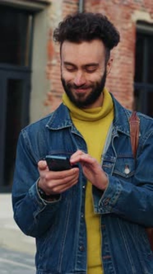 Man Using Smartphone in Urban Setting