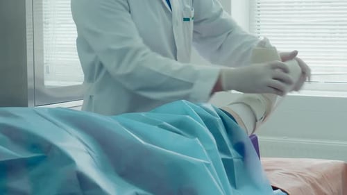 Orthopedic Care Applying a Cast to Treat a Fractured Ankle or Leg