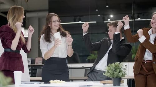 Excited Office Team Celebrating Success Together