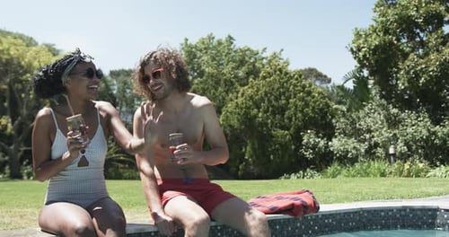 Couple Relaxing Poolside on a Sunny Summer Day