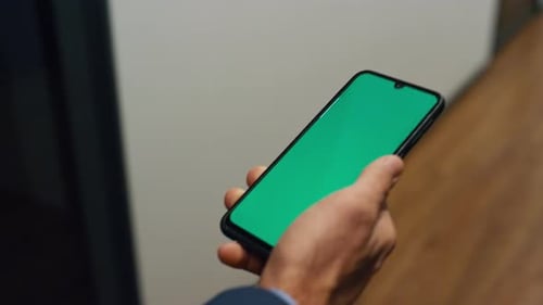 Manager Hands Holding Chroma Key Phone Closeup. Businessman Walk Office Corridor Checking