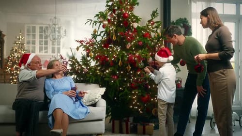 Family Decorating Christmas Tree and Celebrating Together