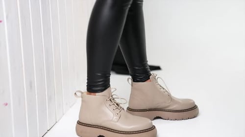 Stylish Beige Boots with Black Leggings Fashion Close-Up