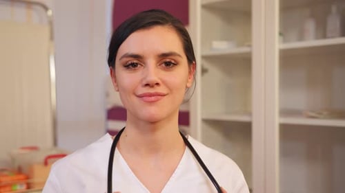 Smiling Woman Medical Professional in White Uniform