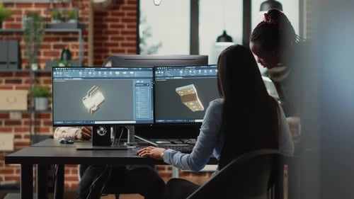 Engineers Working on 3D Modeling Project in Office