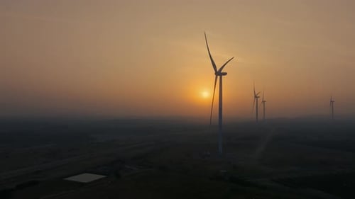 Wind Turbines at Twilight Aerial View of Renewable Energy Farm at Golden Hour Sustainable Power