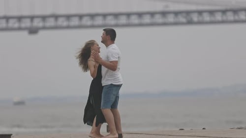 A Cute Romantic Married Couple Dancing on the Pier in Cloudy Weather