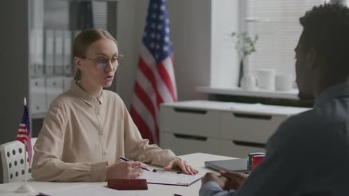 Consular Officer Approving Visa Application during Interview at US Embassy