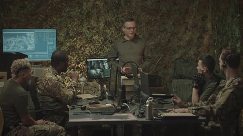 Military Officer Speaking to His Team in Military Control Center