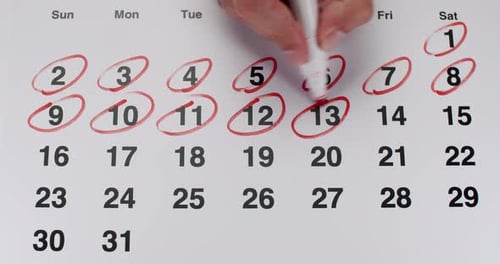 Dates Circled on Calendar with Red Marker