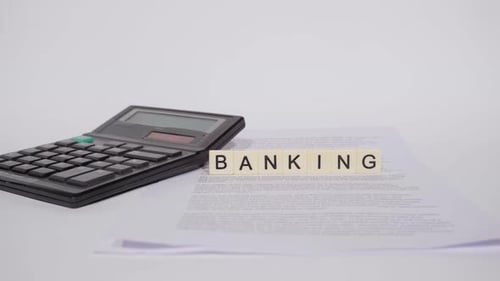 Calculator and Banking Letter Tiles on White