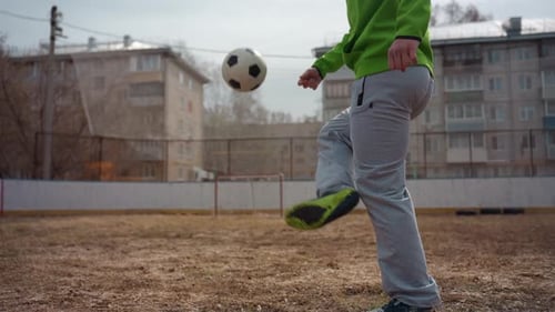 Relaxed Urban Footwork and Juggling Demonstration Leisurely Street Soccer Practice Emphasizing Ball