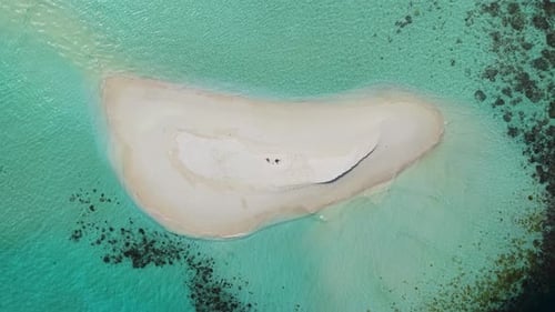 Aerial View of a Maldives Island with Turquoise Waters and a Sandbar