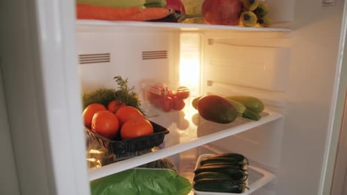 Opening Refrigerator Full of Fresh Produce