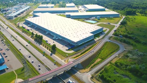 Aerial view of warehouse storages or industrial factory or logistics center from above. Aerial view