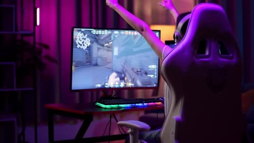 Woman Plays Video Game, Cheers Victory