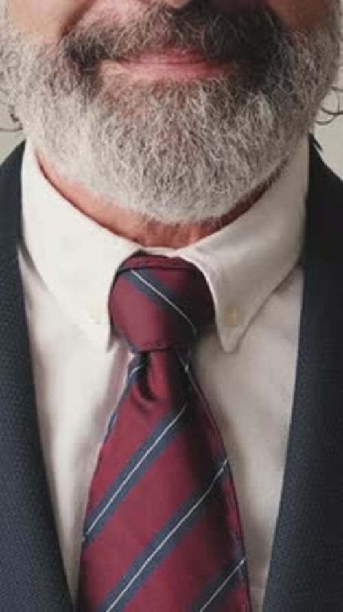 Close up, businessman smiling, on gray background
