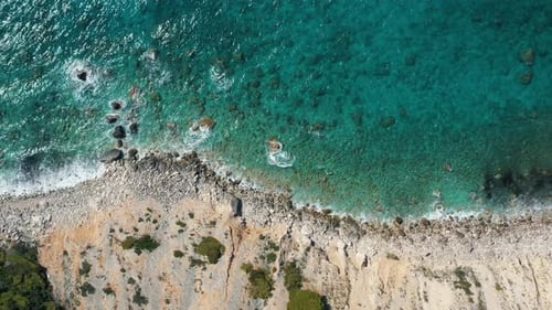 Aerial View of Crystal Clear Sea and Rocky Shore