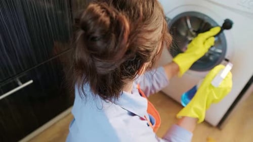 A clean washing machine is key to fresh laundry The owner carefully cleans the drum from buildup and
