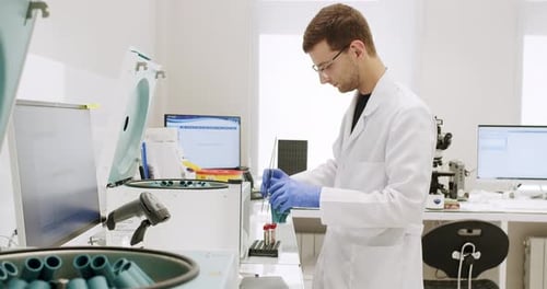 Scientist Conducting Medical Experiment in Bright Laboratory