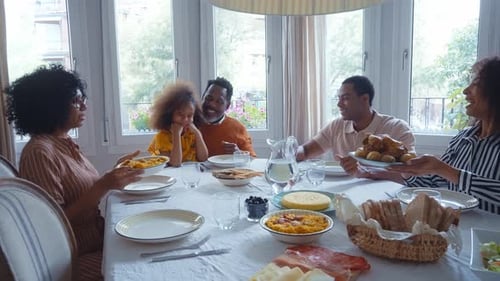 Family Gathering for Meal at Home During Daytime