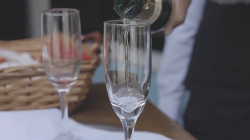 A close-up view of a champagne flute filled with bubbly drink