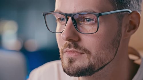 Businessman Analyzing Stock Market Eyeglasses Reflection of Trading Platform Thoughtful Investor Guy