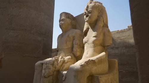 White Egyptian sculpture of Pharaoh and his wife in Luxor Temple, Egypt