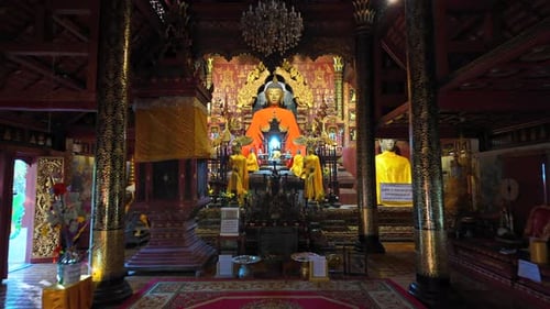 Ornate Buddhist Temple Interior with Buddha Statues