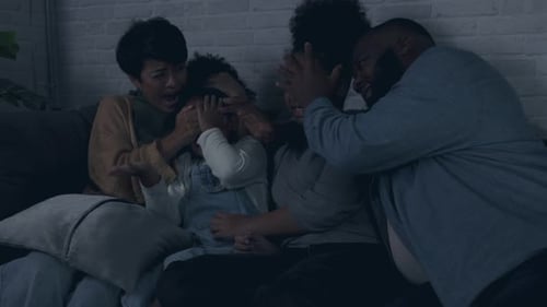 Family Scared While Watching a Movie on Couch