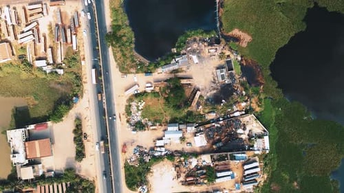 Vehicles are moving from a beautiful road in Dhaka city nearby a lake