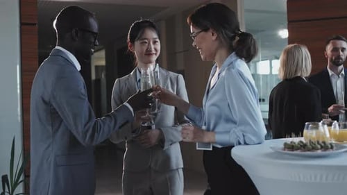 Business People Clinking Glasses With Champagne