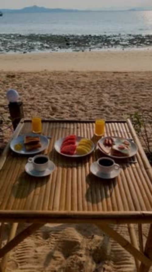Breakfast on the Beach with Coffee and Bread with Egs and Fruit Beach in Thailand Trang