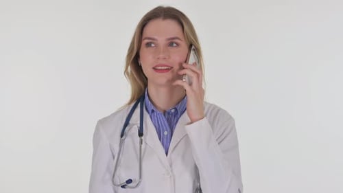 Female Doctor Talking on Phone in White Room
