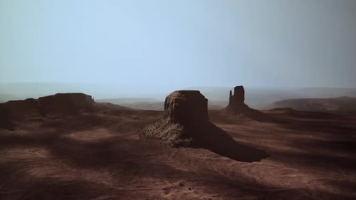 A Majestic Rock Formation Rising From the Vast Desert Landscape