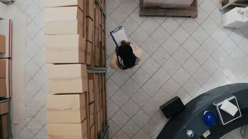 African American Colleagues Organizing Stock on Racks