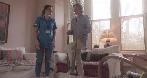 Woman Exercising with Physical Therapist in Living Room