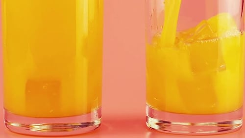 Juice Being Poured Into Glass With Ice