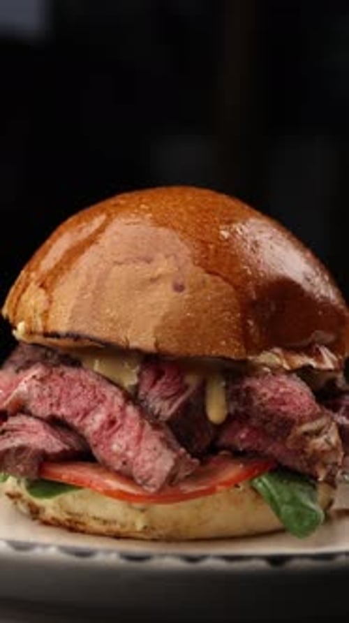 Delicious and juicy hamburger in a restaurant. Close up
