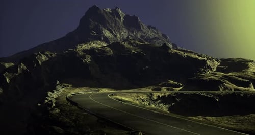 Winding Road Leads to Majestic Mountain Under Mystical Twilight Glow
