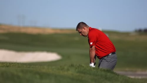 Golfer Hits Ball,