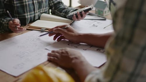 Close up of business's hands selling and buying the house properties.