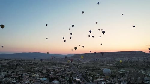 Balloons Fly Over Cappadocia at Colorful Sunrise