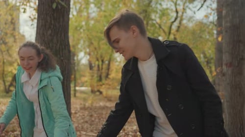 Joyful Family Helps Toddler Walk Parent Guides Child Walking in Sunny Park Supportive Parents Assist