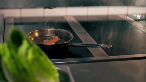 Close Up in a Professional Kitchen a Piece of Chicken Fillet is Fried in Small Frying Pan