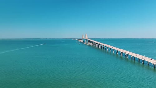 Aerial View of Sunshine Skyway Bridge Over Tampa Bay in Florida with Moving Traffic