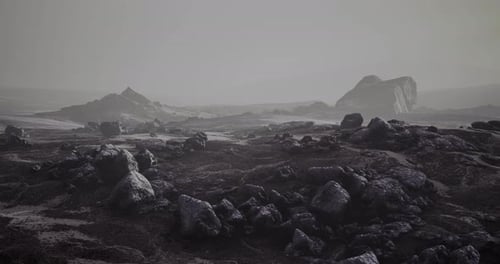 Dramatic Rocky Landscape Under a Muted Sky with Distant Formations