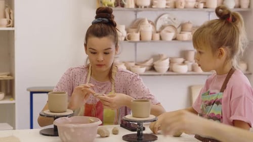 Kids Enjoy Pottery Making Together in a Creative Workshop Setting